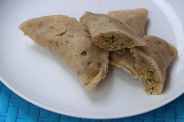 Bihari Dal Pitha, Pithas, popular rice flour dumplings made with rice flour dumplings filed with spicy filling of Dal, traditional Indian Food
