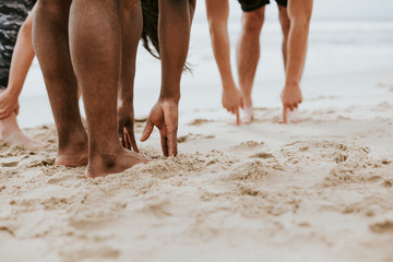 Pre-workout stretch at the beach