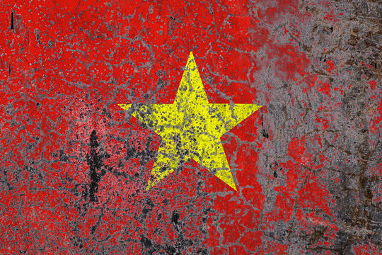 National flag on old peeling wall background.