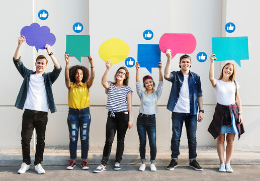 Teens Holding Text Boxes