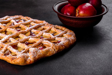 Delicious fresh pie baked with apple, pears and berries