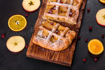 Delicious fresh pie baked with apple, pears and berries