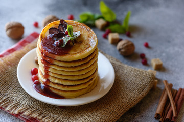 Delicious fresh beautiful pancakes with citrus honey and jam