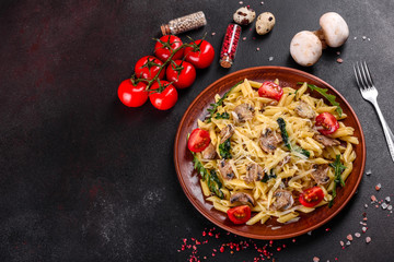 Pasta with mushrooms, cheese, spinach, rukkola and cherry tomatoes