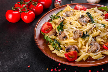 Pasta with mushrooms, cheese, spinach, rukkola and cherry tomatoes