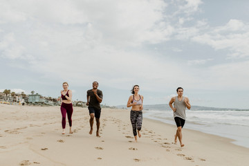 Fit people jogging on the beach
