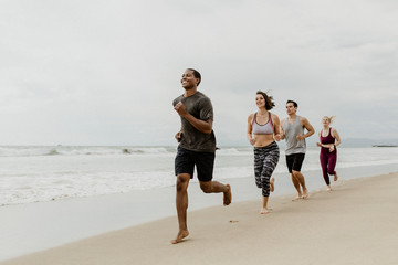 Fototapeta premium Fit people jogging on the beach