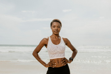 Fototapeta na wymiar Active woman posing on the beach