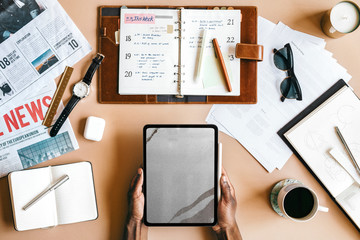 Tablet on a desk flatlay
