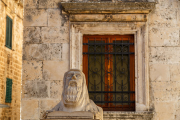 HVAR / CROATIA - AUGUST 2015: Statue of praying monk in the historic centre of Hvar town on Hvar island, Croatia