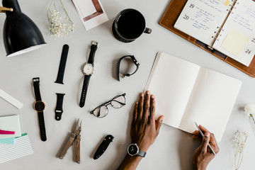 Watchmaker taking a note