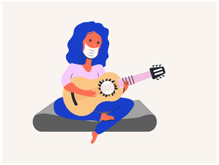 A girl in a medical mask plays the guitar during quarantine on a mattress