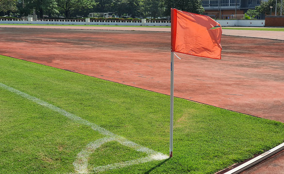 A orange flag at one corner of football,soccer field