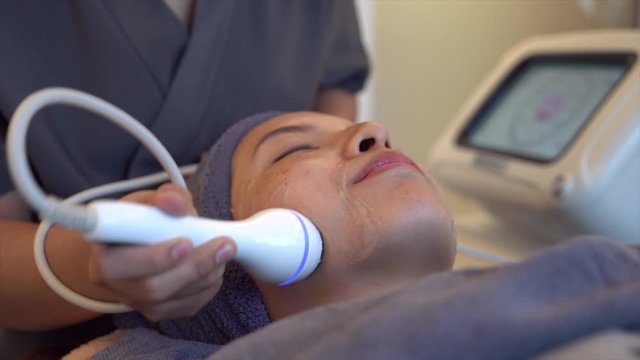 Female receiving Anti-Aging cosmetics using ultrasound cavitation machine.