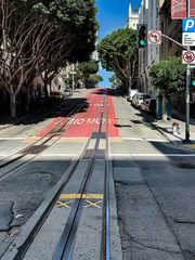 Traffic light on the street and muni cable car railway