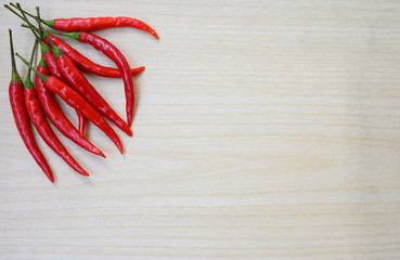 Fresh Red hot chilli peppers on clean wooden background, Flat lay composition with copy Space for...
