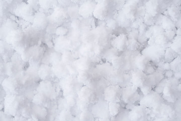 Background of fresh white snow. Winter snowflakes texture. Snow white texture winter background. Icy surface pattern. Shiny snow with bokeh. Macro shot