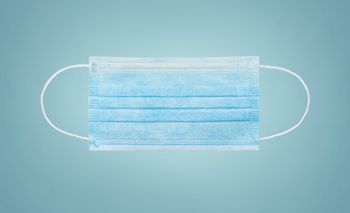 Protective hygiene mask on blue background