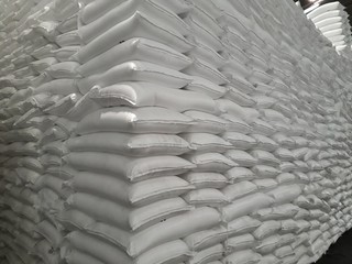 Obraz premium The product stock is packed in sacks, stacked in the warehouse, waiting for delivery.