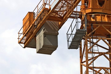 Construction site. Сoncrete slabs   counterweights on the crane