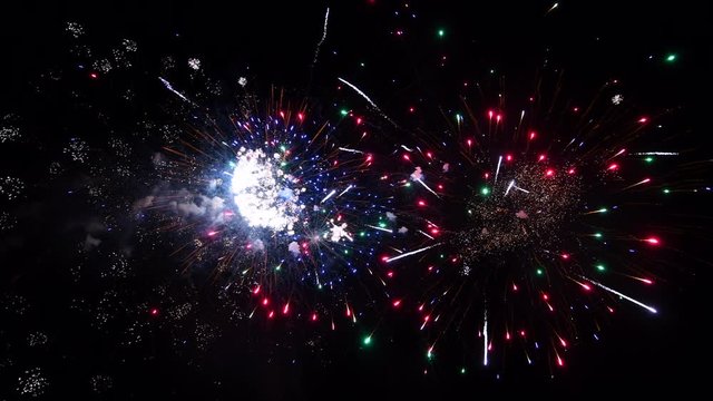 4K abstract fireworks isolated on deep black night background