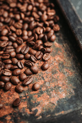 Coffee beans on the rustic background. Selective focus. Shallow depth of field.
