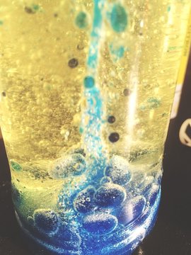 Close-up Of Bubbles In Lava Lamp On Table