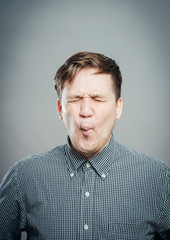 Man sucking in his cheeks