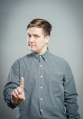 man pointing up with his index finger