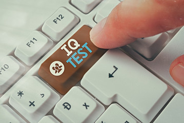 Writing note showing Iq Test. Business concept for attempt to measure your cognitive ability Assess intelligence