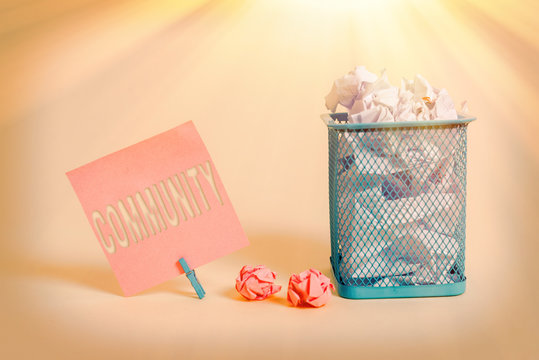 Writing note showing Community. Business concept for group of showing with a common characteristics living together Note paper and stationary placed above soft pastel colour backdrop