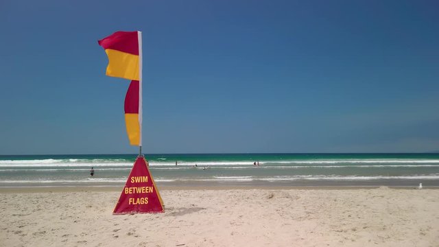 Swim between the flags at the beach, New Zealand