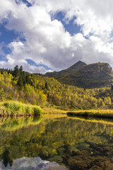 autumn landscape with mountains and blue sky