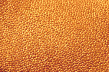 The texture of genuine leather. Brown background.