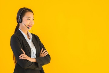 Portrait beautiful young business asian woman with headphone or headset