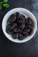 prunes, dried plums (tasty and healthy fruits) desiccated keto or paleo diet
menu concept. background. top view. copy space for text