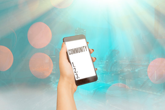 Conceptual hand writing showing Community. Concept meaning group of showing with a common characteristics living together