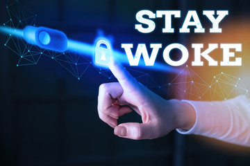 Writing note showing Stay Woke. Business concept for being aware of your surroundings and things...
