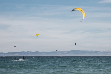 Man is practicing kitesurf.