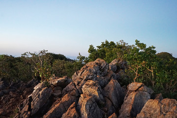 Obraz premium Natural landscape of Rocky green mountain range with cloudy sky view