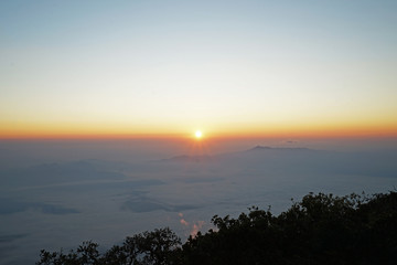 Fototapeta na wymiar Sunrising view on top of the mountain peak
