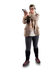 A full-length woman in a jacket, trousers, leggings and with a scarf around her neck holds a gun in her hands isolated on a white background. A head scarf is tied around his head.