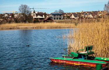 Fototapeta na wymiar An old pleasure boat on the lake