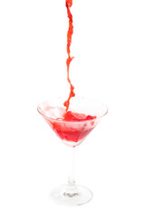 pouring cocktail with splashes isoalted on white background