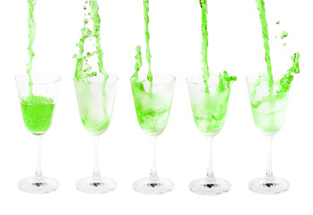 pouring cocktail with splashes isoalted on white background