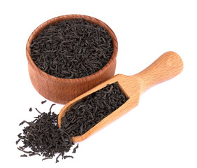 Dried black tea in a wooden bowl,  with a scoop, delicious, natural