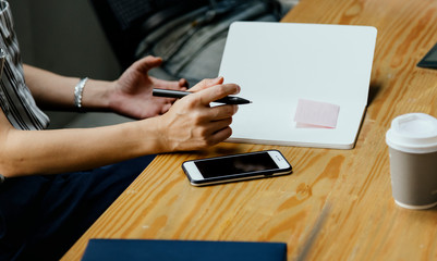 Fototapeta premium Closeup of secretary taking notes in a meeting
