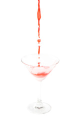 pouring cocktail with splashes isoalted on white background