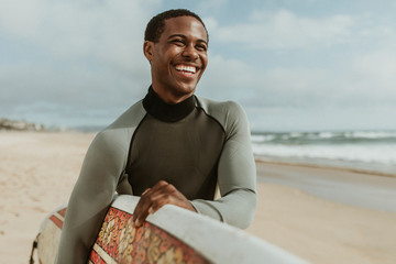 Smiling male surfer - Powered by Adobe