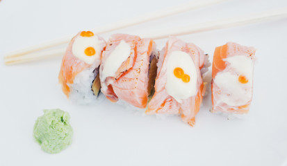 Top view of salmon sushi with chopstick and wasabi in minimal and high key concept.